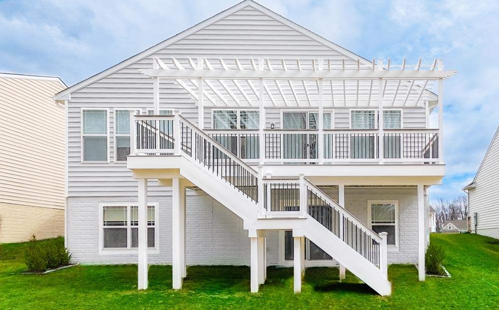 Modern raised deck with railing built by Advance Roofing in Newark, DE.